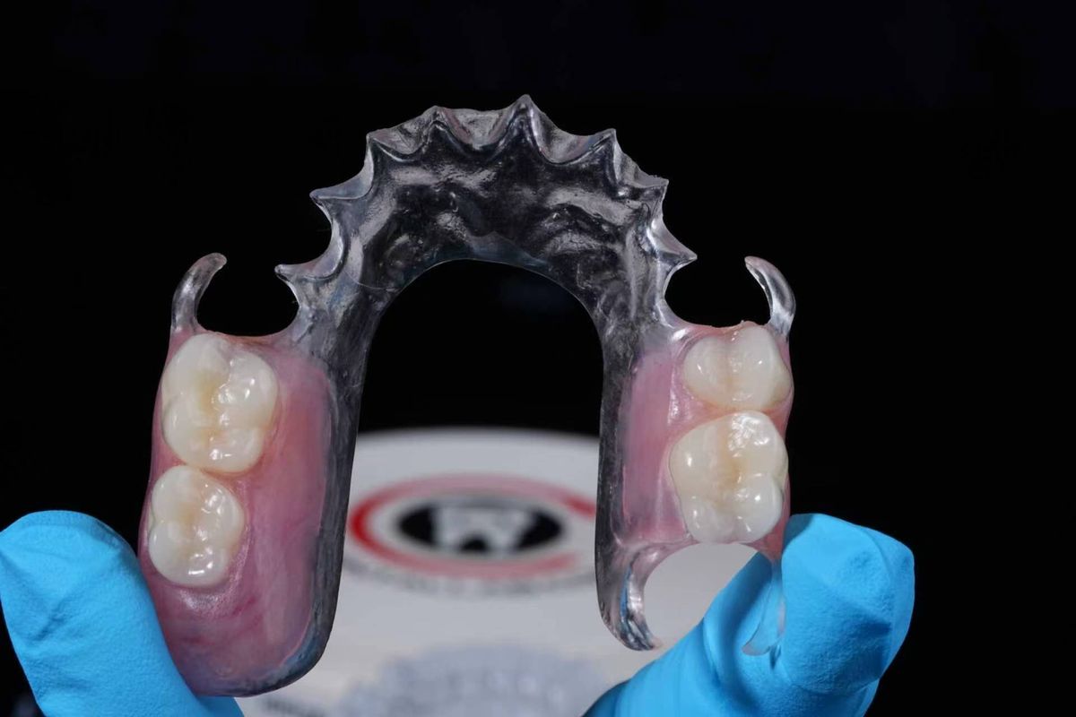 Flexible partial denture with clasps