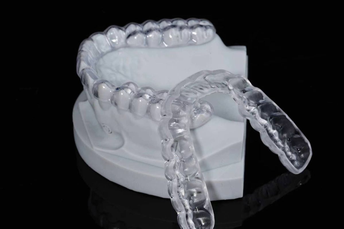 Clear ortho retainers on the model