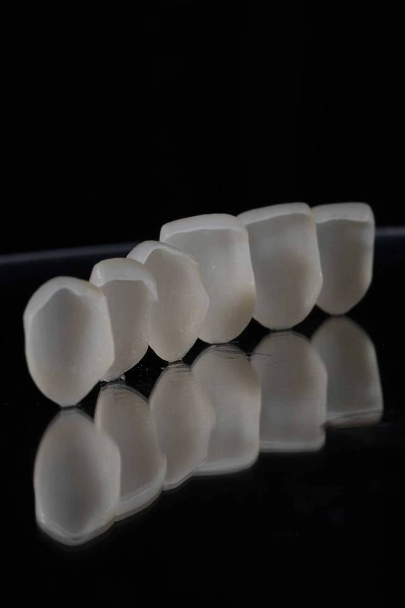 Six pressed veneers lined up